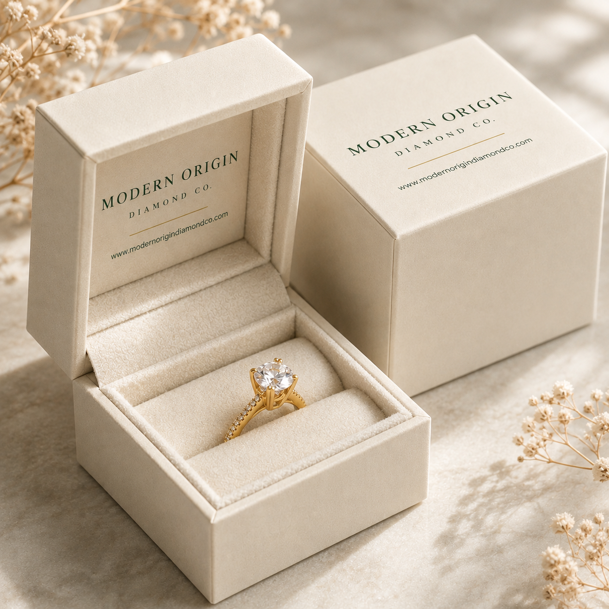 Modern Origin Diamond Co. cream ring box with a laboratory-grown diamond solitaire engagement ring