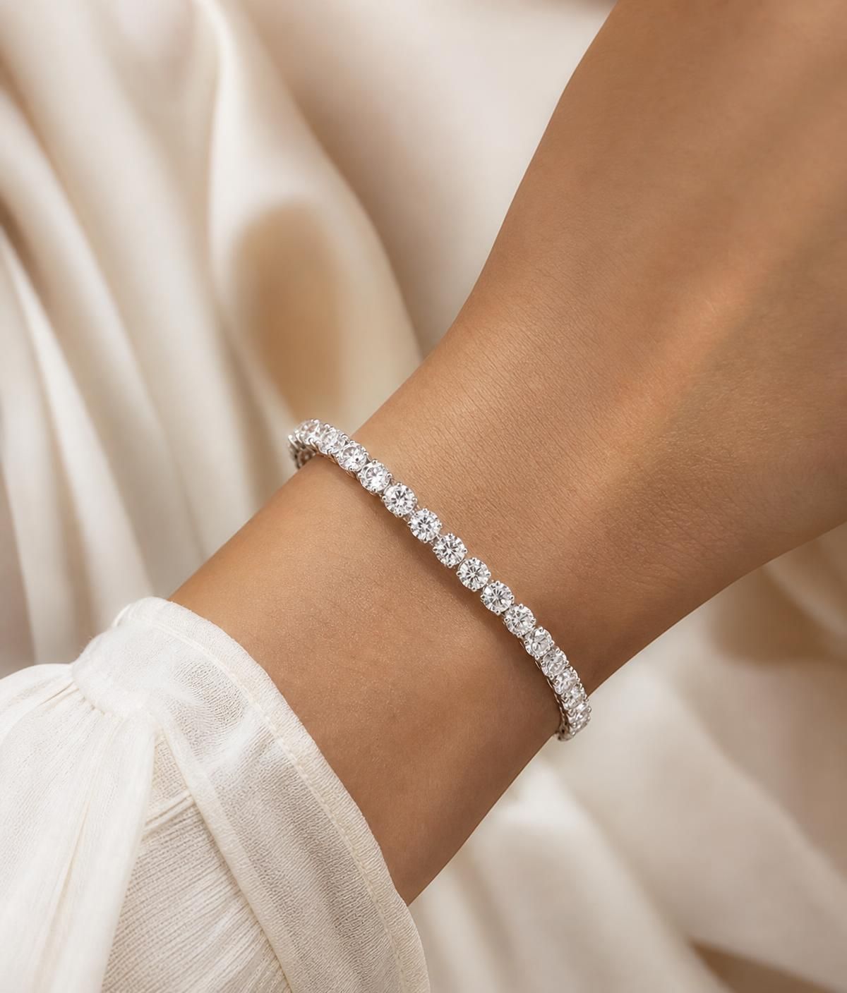 Woman wearing a laboratory-grown diamond tennis bracelet in white gold