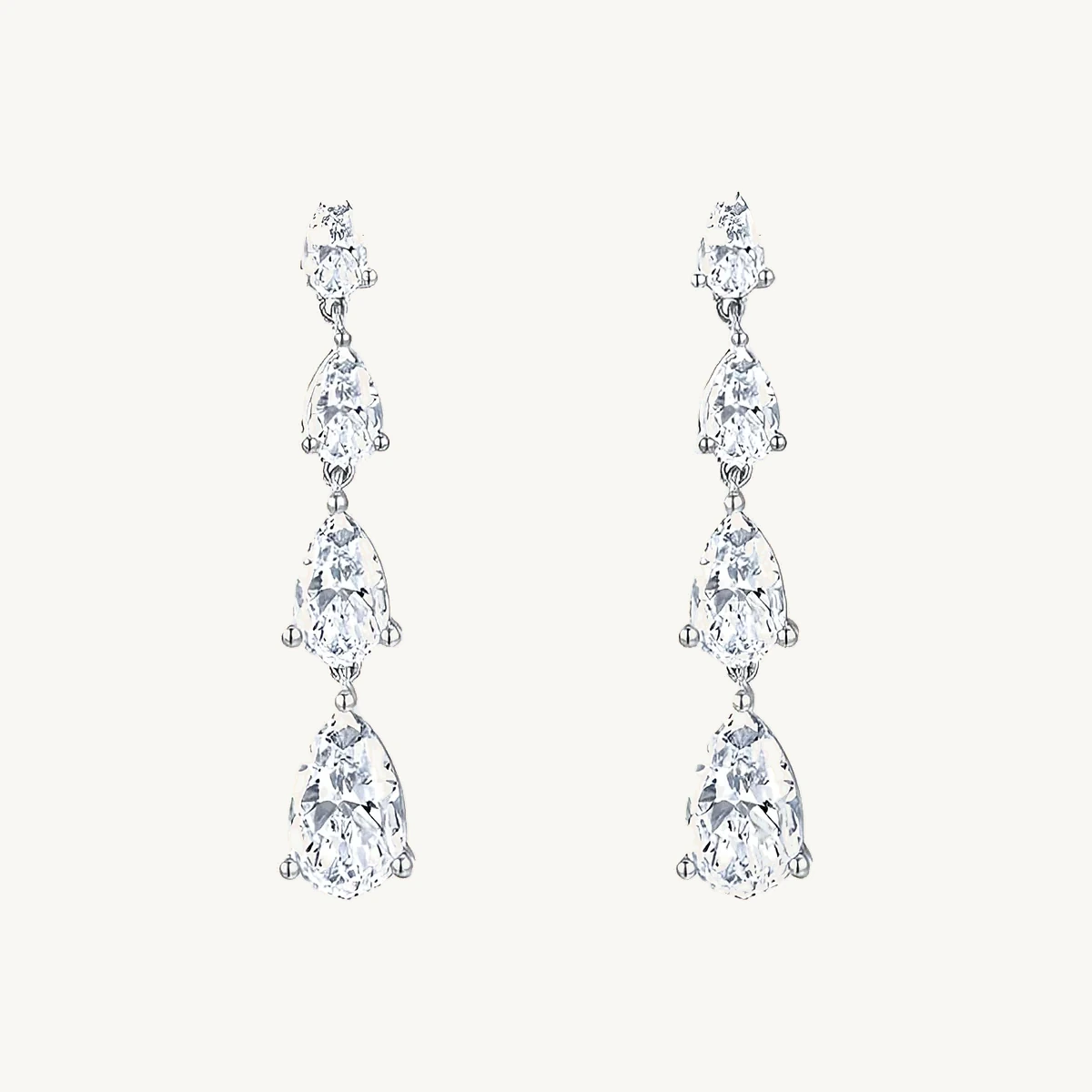 Graduated Pear Drop Earrings in 14k White Gold